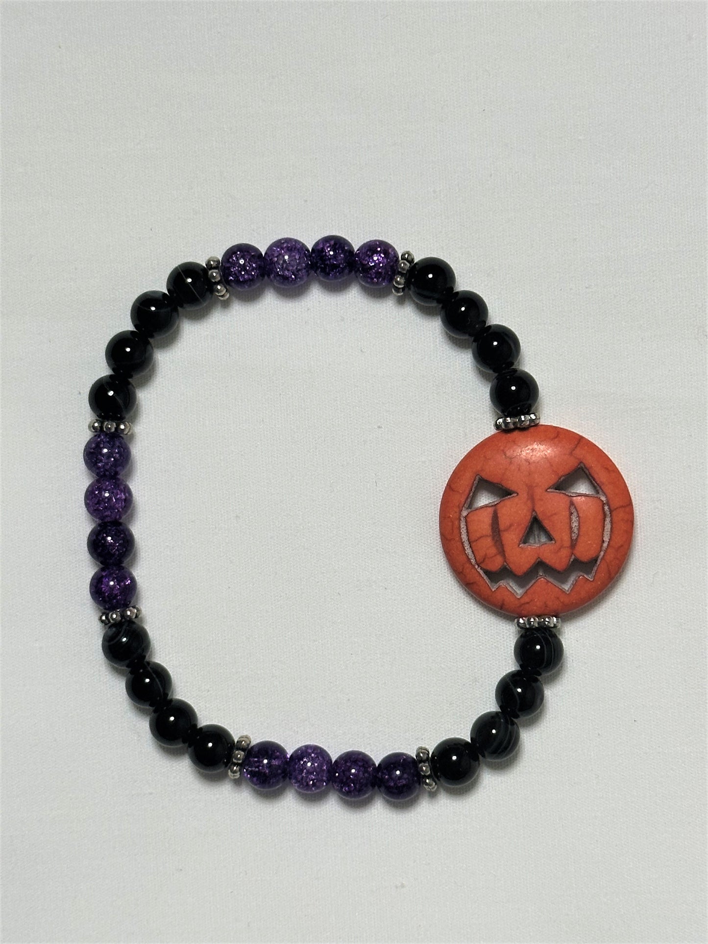 Black Striped Agate, Purple Crackle Quartz With a 25 mm Pumpkin Center Bead Bracelet