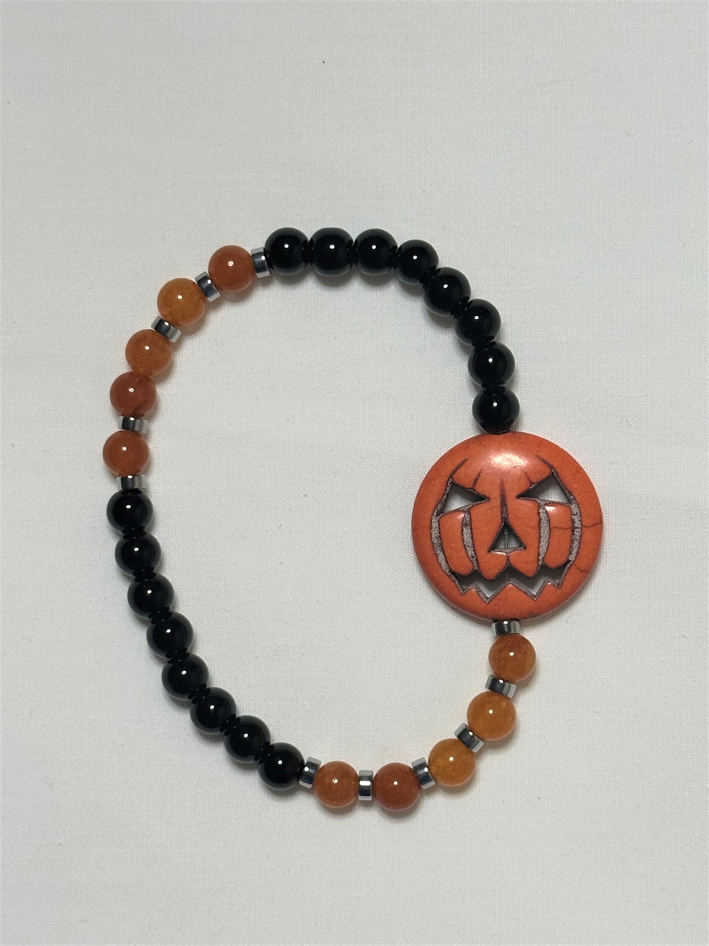Black Jasper, Orange Quartzite, Hematine and Reconstituted Orange Howlite Bead Bracelet