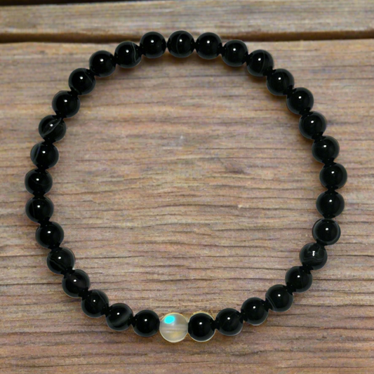 Banded Black Agate With White Synthetic Opal Center Bead Bracelet